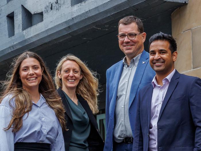 Rebecca, Jane and Viplove from the Bank with Ian from Cyacomb outside their offices.